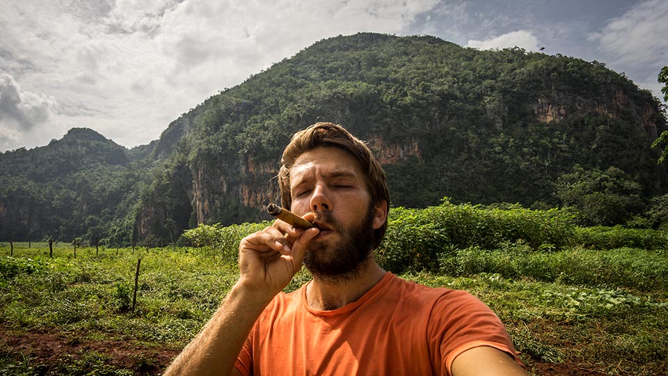 Enjoying my first cigar with an incredible view of rocks that I would climb a few days later.