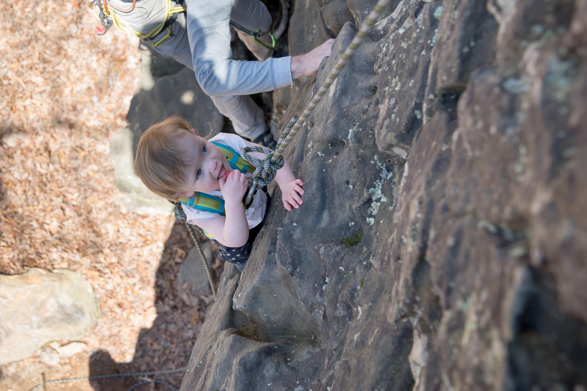 Hannah climbing her first route