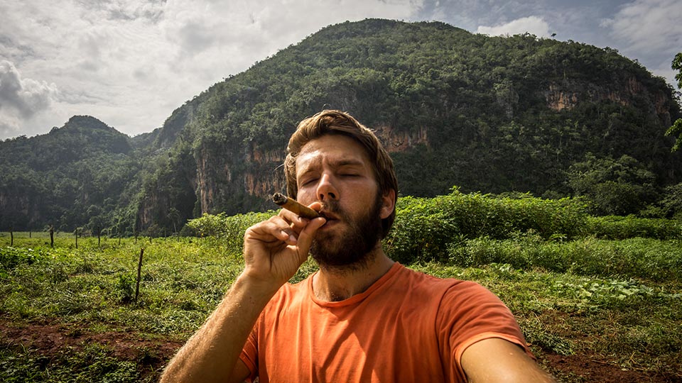 What better place to enjoy your first cigar than in Viñales, Cuba with some nice mountains in the background. A few days later I climbed the rock behind my head!